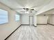 The open floor plan features light grey wood-look floors and neutral wall colors at 2007 N Hastings St, Orlando, FL 32808