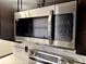 Stainless steel Samsung microwave above the stove, complements modern kitchen design at 2007 N Hastings St, Orlando, FL 32808