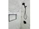 Close up of the modern glass-enclosed shower with black fixtures and marble-style tile at 2007 N Hastings St, Orlando, FL 32808