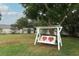 Inviting backyard swing with heart accents, complemented by a storage shed, perfect for relaxation at 205 Sanora Blvd, Sanford, FL 32773