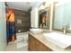 Bathroom featuring a double sink vanity, a shower-tub combo, and neutral colors at 205 Sanora Blvd, Sanford, FL 32773