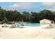 Large community pool with ample seating and lush greenery, perfect for relaxation and recreation at 205 Sanora Blvd, Sanford, FL 32773