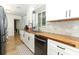 Bright kitchen with butcher block countertops, stainless steel appliances, and ample cabinet space at 205 Sanora Blvd, Sanford, FL 32773