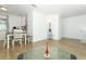 Open-concept living area featuring light wood floors with modern lighting fixtures, and open access to kitchen at 205 Sanora Blvd, Sanford, FL 32773