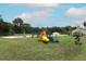 Community playground with colorful slides, a pool, and benches, creating a fun recreation area at 205 Sanora Blvd, Sanford, FL 32773