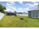 Expansive backyard with a shed, basketball court, and screened pool enclosure at 2117 Stone Abbey Blvd, Orlando, FL 32828