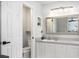 Bathroom features a well-lit vanity with sink and storage, next to the toilet at 2117 Stone Abbey Blvd, Orlando, FL 32828