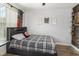This cozy bedroom is styled with basketball themed decor and has natural light from the window at 2117 Stone Abbey Blvd, Orlando, FL 32828