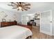 The bedroom offers an adjacent office space, separated by glass french doors at 2117 Stone Abbey Blvd, Orlando, FL 32828