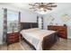 This primary bedroom features wood-look flooring and a ceiling fan, providing a comfortable retreat at 2117 Stone Abbey Blvd, Orlando, FL 32828