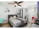 This bedroom features a wall-mounted decor and desk, perfect for relaxing and working at 2117 Stone Abbey Blvd, Orlando, FL 32828