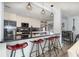 Modern kitchen featuring granite countertops, stainless steel appliances, and stylish pendant lighting at 2117 Stone Abbey Blvd, Orlando, FL 32828