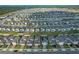 Expansive aerial view of a well-planned residential community with neatly arranged homes and manicured lawns at 2304 Mystic Maze Ln, Clermont, FL 34715
