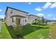Spacious backyard with a well-maintained lawn and partial fencing, perfect for outdoor activities at 2304 Mystic Maze Ln, Clermont, FL 34715