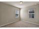 Neutral carpeted bedroom offers dual windows and a comfortable atmosphere for relaxation at 2304 Mystic Maze Ln, Clermont, FL 34715
