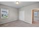 Neutral bedroom boasts carpet floors, a double door closet, and a window, creating a calm retreat at 2304 Mystic Maze Ln, Clermont, FL 34715