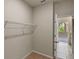 Walk-in closet features shelving providing functional storage space at 2304 Mystic Maze Ln, Clermont, FL 34715
