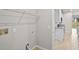 The laundry room provides functionality with shelving and convenient access to kitchen at 2304 Mystic Maze Ln, Clermont, FL 34715