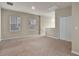 Upstairs loft area with neutral carpets, a double-door closet, and a ceiling vent at 2304 Mystic Maze Ln, Clermont, FL 34715