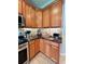 Cozy kitchen with stainless appliances, granite countertops, and tile backsplash at 27401 Pine Straw Rd, Leesburg, FL 34748
