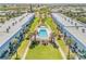 Aerial view of the condo community, showcasing meticulously maintained landscaping and a refreshing pool at 2750 Ocean Shore Blvd # 350, Ormond Beach, FL 32176