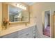 Bathroom vanity featuring ample storage, large mirror, and good lighting at 2750 Ocean Shore Blvd # 350, Ormond Beach, FL 32176