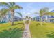 Beautifully landscaped grounds with mature palm trees in a condo community setting at 2750 Ocean Shore Blvd # 350, Ormond Beach, FL 32176