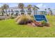 Beautiful condo building with ocean views and lush landscaping; signage reads Villa Sereno at 2750 Ocean Shore Blvd # 350, Ormond Beach, FL 32176