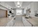 Bright white kitchen featuring modern countertops and stainless steel appliances; tile flooring at 2750 Ocean Shore Blvd # 350, Ormond Beach, FL 32176