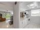 Bright kitchen with white cabinets and access to dining area with backyard view at 2750 Ocean Shore Blvd # 350, Ormond Beach, FL 32176