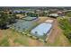 Aerial view of the community athletic courts, including tennis, basketball, sand volleyball, and hockey at 2842 Balforn Tower, Winter Garden, FL 34787