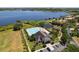 Aerial view of the community pool and clubhouse located near a lake and boat docks at 2842 Balforn Tower, Winter Garden, FL 34787