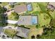 Aerial view of the home, pool, lanai, driveway and landscaping within the community at 2842 Balforn Tower, Winter Garden, FL 34787