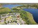 Aerial view showcasing the community, lake, and the property's location near a natural preserve at 2842 Balforn Tower, Winter Garden, FL 34787