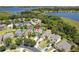 Aerial view showcasing the home's location near a serene lake and lush green surroundings at 2842 Balforn Tower, Winter Garden, FL 34787