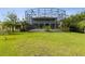 Expansive backyard with a view of a screened pool and home exterior at 2842 Balforn Tower, Winter Garden, FL 34787