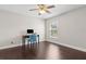 This bedroom features wood floors, and a large window for lots of bright natural light at 2842 Balforn Tower, Winter Garden, FL 34787