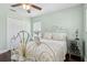 Comfortable bedroom features wood floors, a ceiling fan, a closet, and white trim at 2842 Balforn Tower, Winter Garden, FL 34787