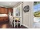 Bright dining area with views of pool and stainless appliances at 2842 Balforn Tower, Winter Garden, FL 34787