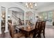 Spacious dining room with decorative columns, hardwood floors, and ample natural light at 2842 Balforn Tower, Winter Garden, FL 34787