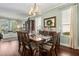 Inviting dining space with hardwood floors, a large armoire, and abundant natural light at 2842 Balforn Tower, Winter Garden, FL 34787