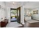 Elegant foyer with hardwood floors, a decorative rug, and views of the living room and front yard at 2842 Balforn Tower, Winter Garden, FL 34787