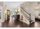 Elegant foyer with hardwood floors, staircase, and stylish decor, making a grand first impression at 2842 Balforn Tower, Winter Garden, FL 34787