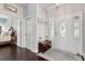 Entryway featuring dark hardwood floors, a decorative rug, and access to multiple rooms in the home at 2842 Balforn Tower, Winter Garden, FL 34787