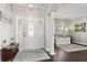 Bright foyer with a white front door, dark wood floors, and a view of the living room at 2842 Balforn Tower, Winter Garden, FL 34787