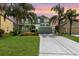 Charming two-story home boasts lush landscaping, a two-car garage, and a welcoming front entrance at 2842 Balforn Tower, Winter Garden, FL 34787