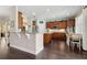 Bright kitchen with stainless steel appliances, wood cabinets, and an island at 2842 Balforn Tower, Winter Garden, FL 34787