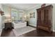 Cozy living room with hardwood floors, a white sofa, and an elegant armoire for storage at 2842 Balforn Tower, Winter Garden, FL 34787