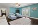 Inviting living room with hardwood floors and stylish seating, perfect for relaxation and entertaining guests at 2842 Balforn Tower, Winter Garden, FL 34787