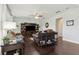Bright and airy living room with hardwood floors, a ceiling fan, and a built-in entertainment center at 2842 Balforn Tower, Winter Garden, FL 34787